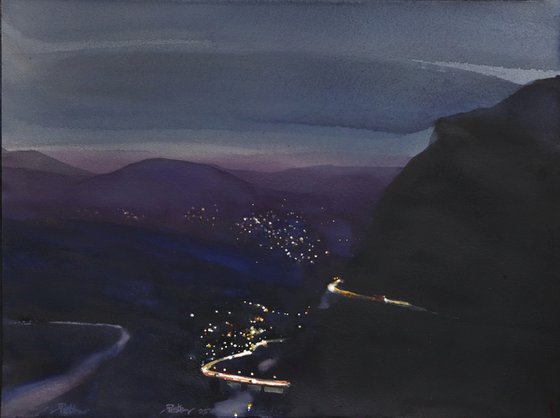 Night lights, moutain road