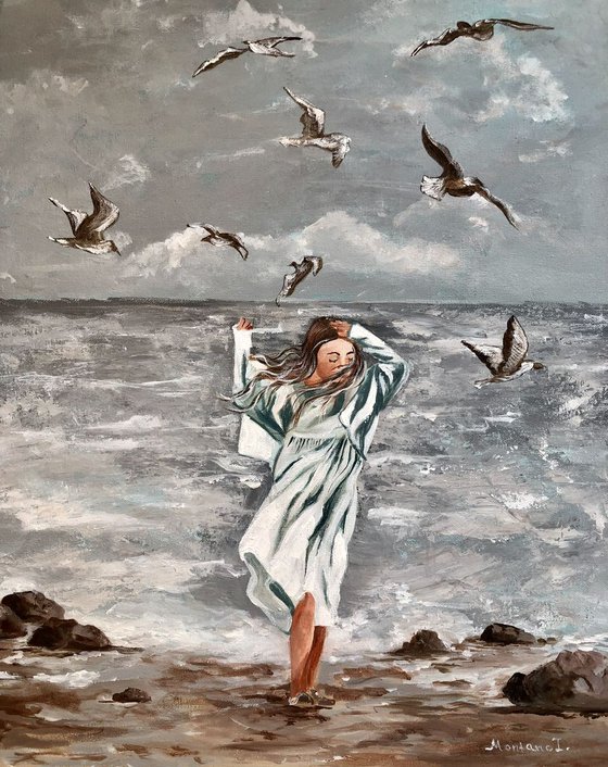 Girl and seagulls by the sea