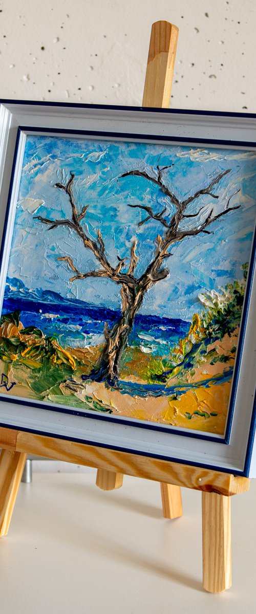 Dead tree by the sea (framed) by Vladyslav Durniev