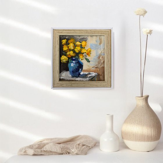 Sunlit Bouquet in a blue vase.