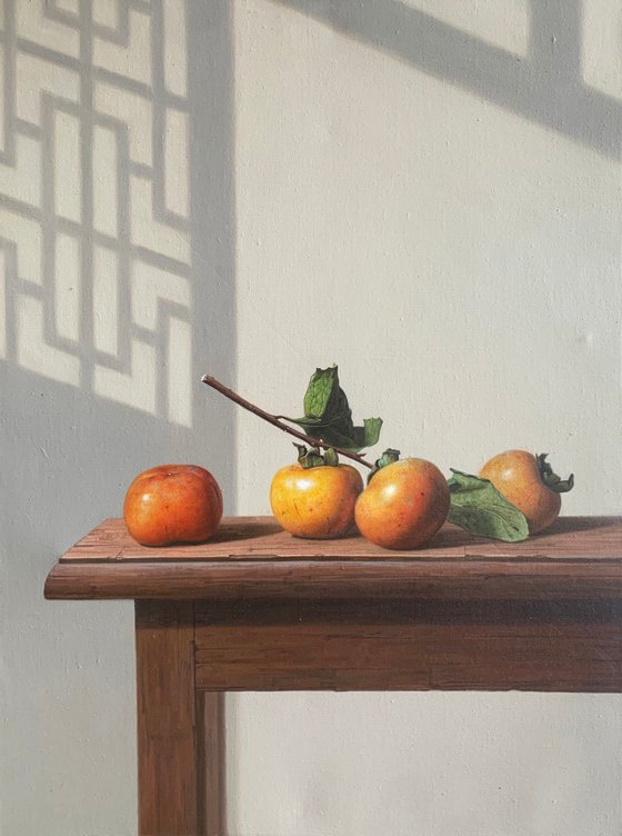 Still life:persimmons on the wooden table