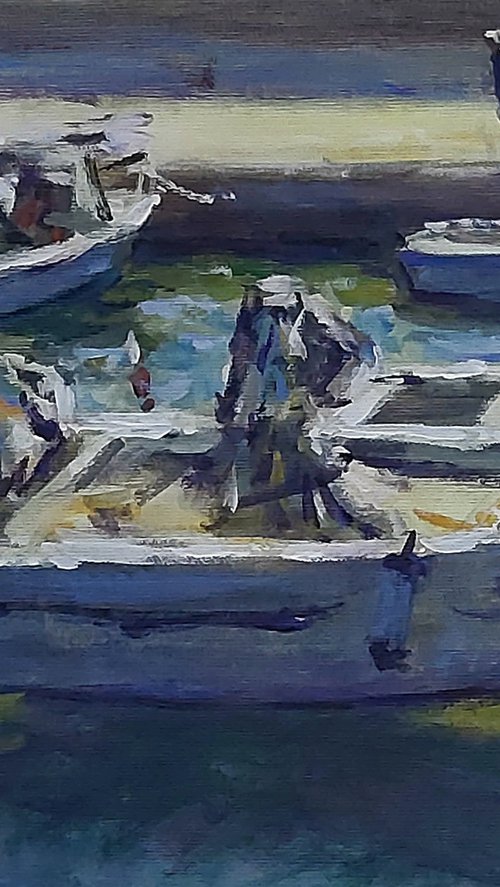 Boats in a small harbour by Dimitris Voyiazoglou