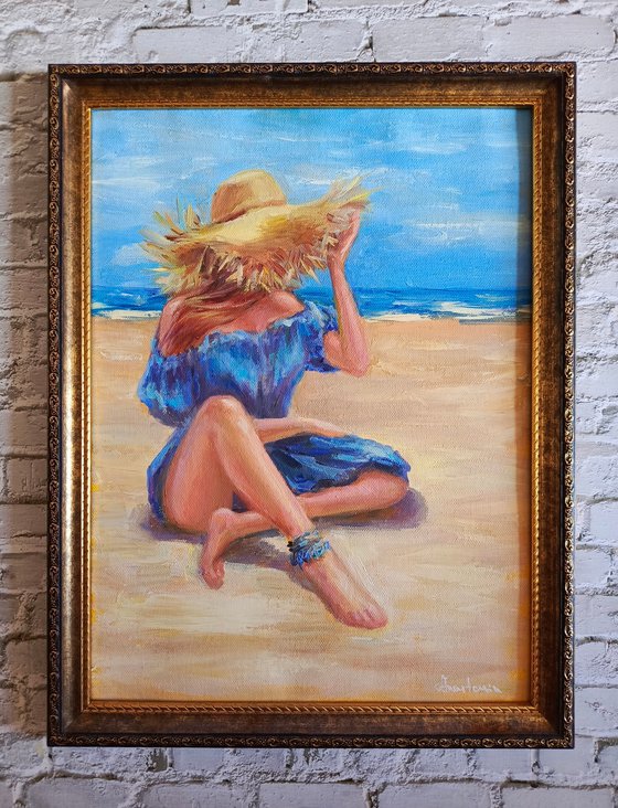 Woman in hat on beach