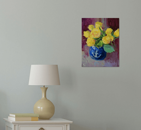 Yellow tulips in a blue vase