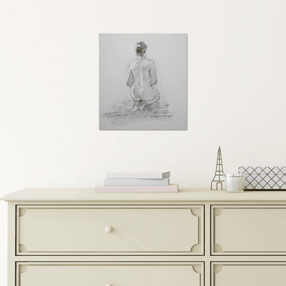 Seated female nude back view