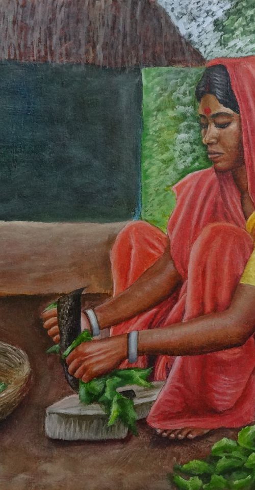 Woman Preparing greens by Ramya Sadasivam