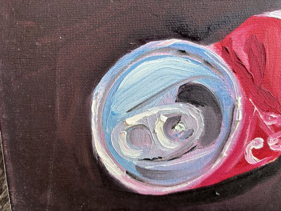 A crushed cola can