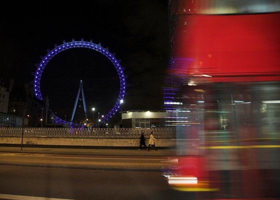 London Eye and a passing bus taken at night. (Sm)