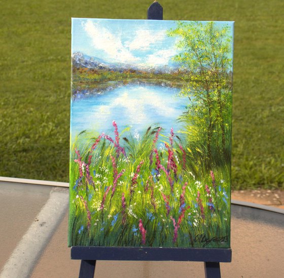 Lake with wildflowers meadow