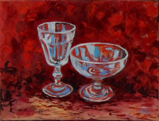 Wine glass on red.