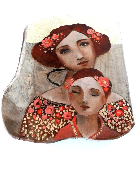 Mother and daughter, portrait on wood, piece of teak. Pink osmosis.