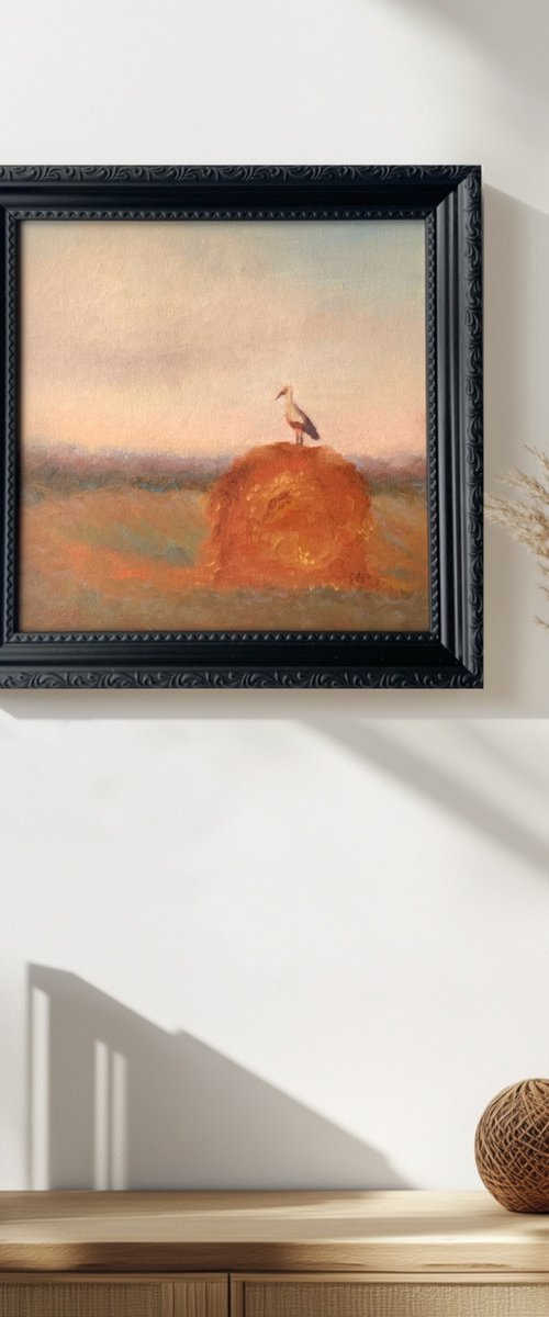 Stork on a haystack, in frame by Alena Post