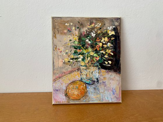 Still life with flowers and orange