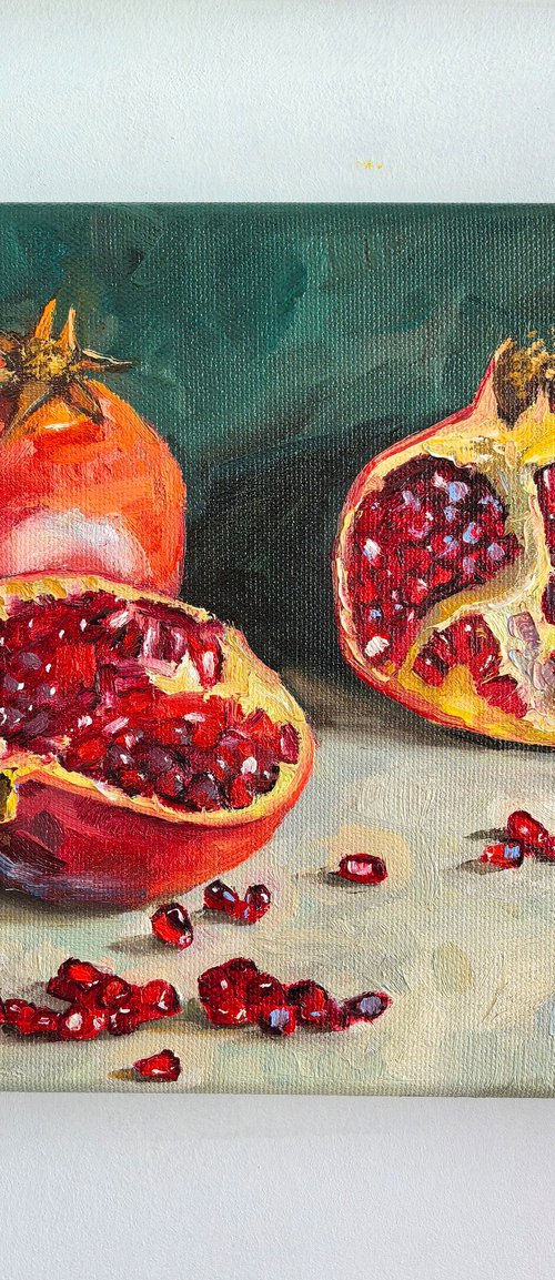 Pomegranate on blue by Leyla Demir