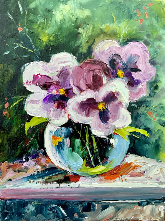 Pansies in a glass vase