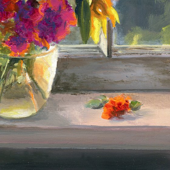 Vase of marigolds on a window