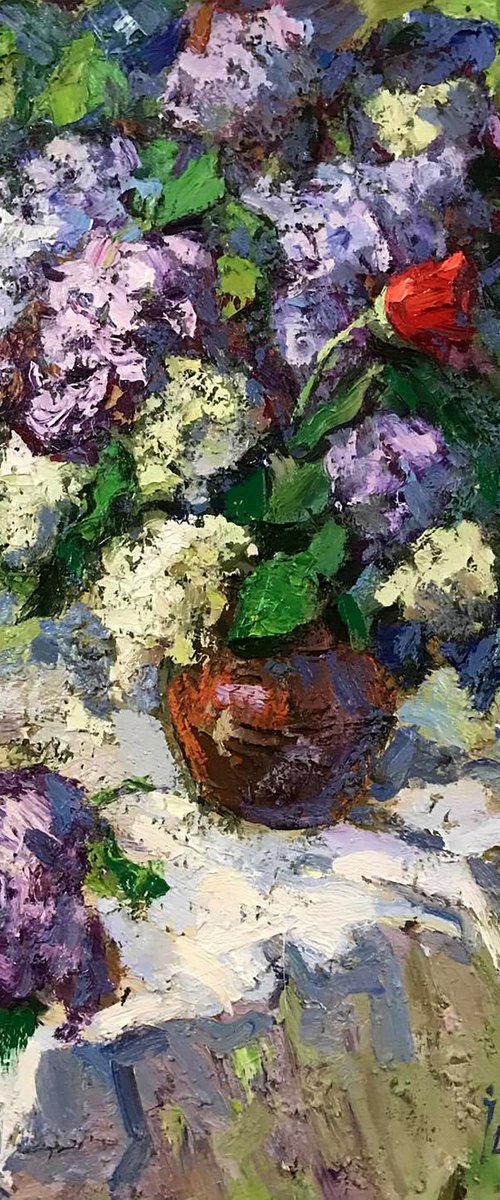 A bouquet of lilacs on the table by Kalenyuk Alex