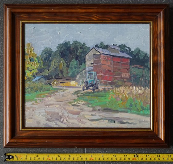 Blue tractor at the sawmill. Rodnya village