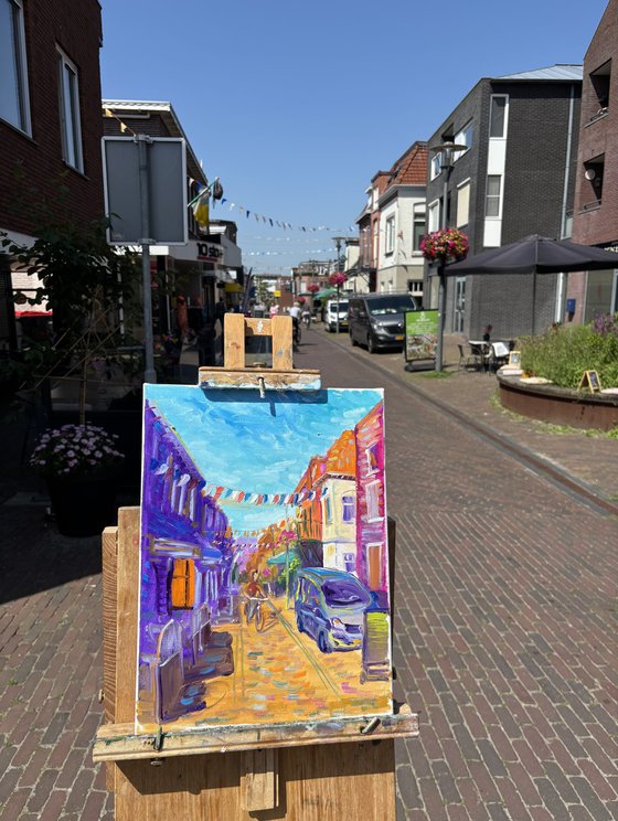 Festive Dutch town scene with cyclist