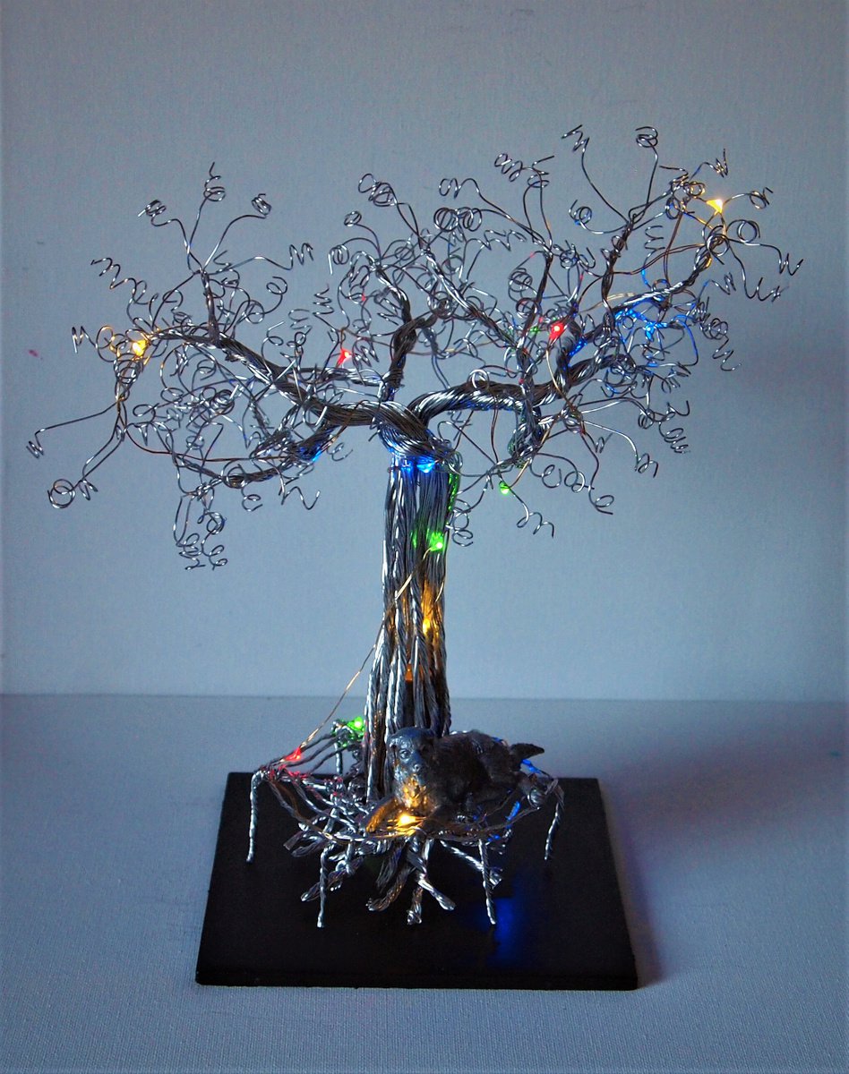 Silver wire tree sculpture with dog, tree bench and LED lights by Steph Morgan