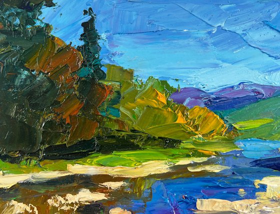 River against the Backdrop of Mountain Slopes