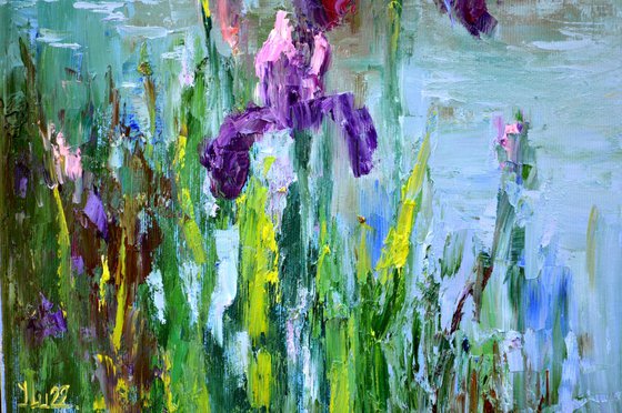 Three Irises by the pond