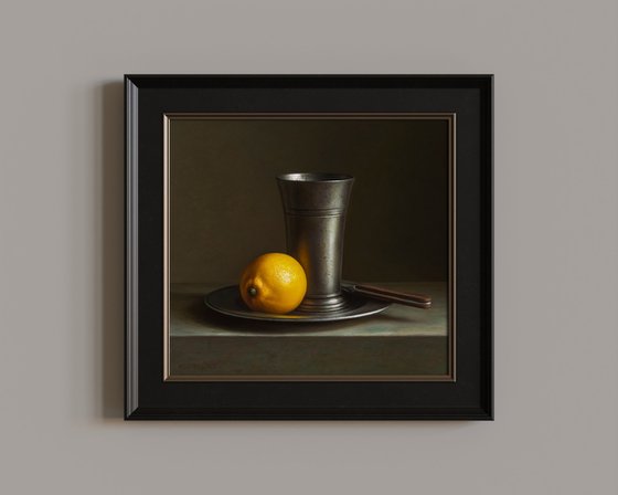 Lemon with a pewter beaker