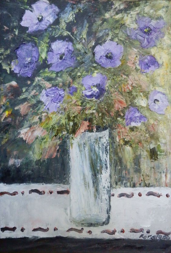 Petunias in a glass vase