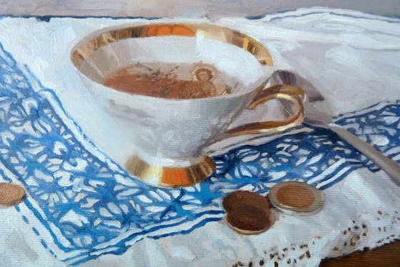 A cup of tea and coins