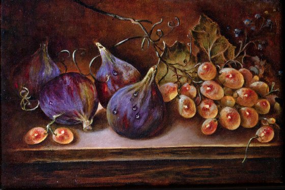 Still life with figs and a bunch of grapes