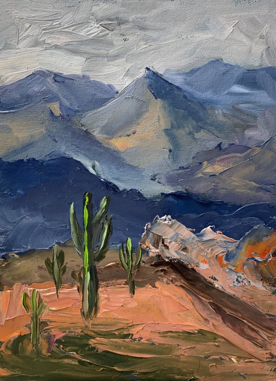 Mountains and cacti.