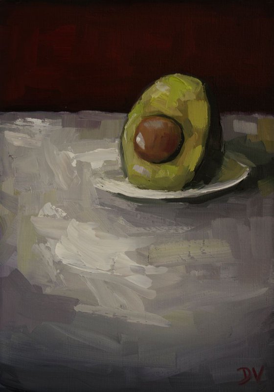 Avocado with plate.