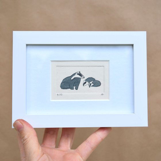 Small framed badger and two young