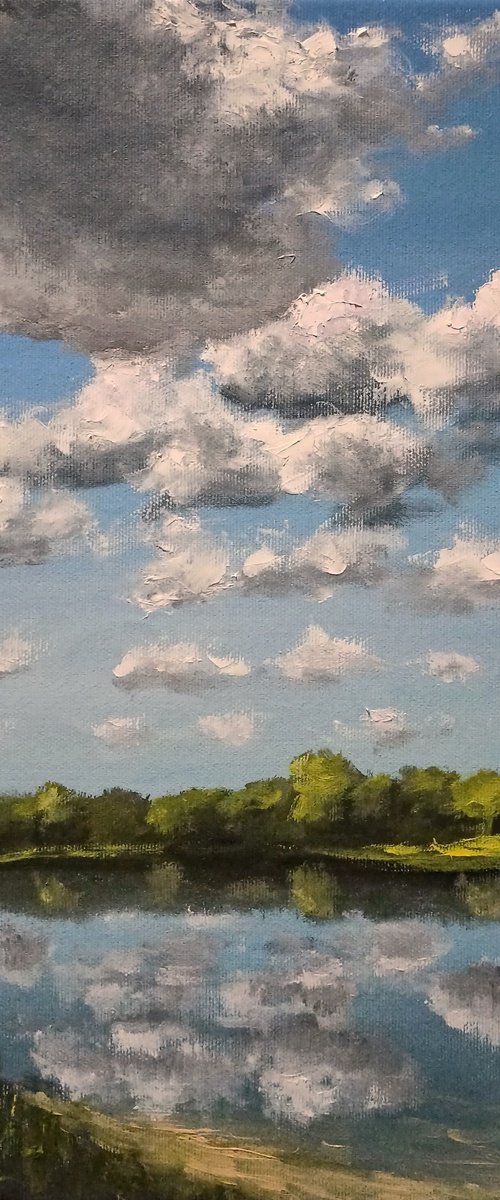 Clouds over the lake by Oleh Rak