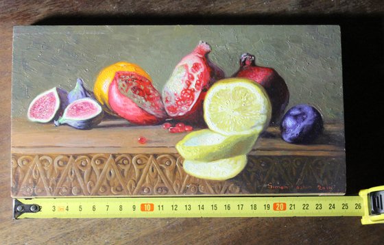 Still life with lemon and pomegranate