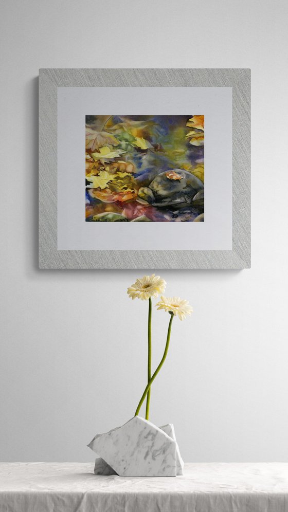autumn leaves in water