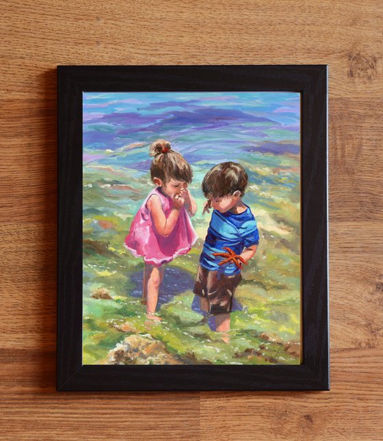 Children with starfish on the beach