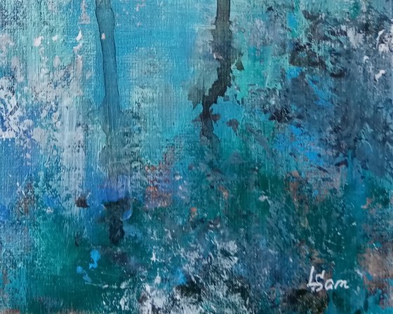 A window in a turquoise wall