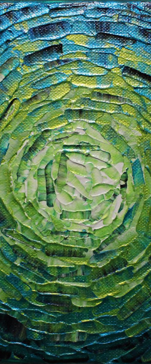 Small shine of iridescent green blue glow by Jonathan Pradillon