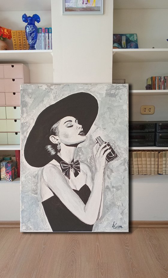Woman with a bottle of perfume
