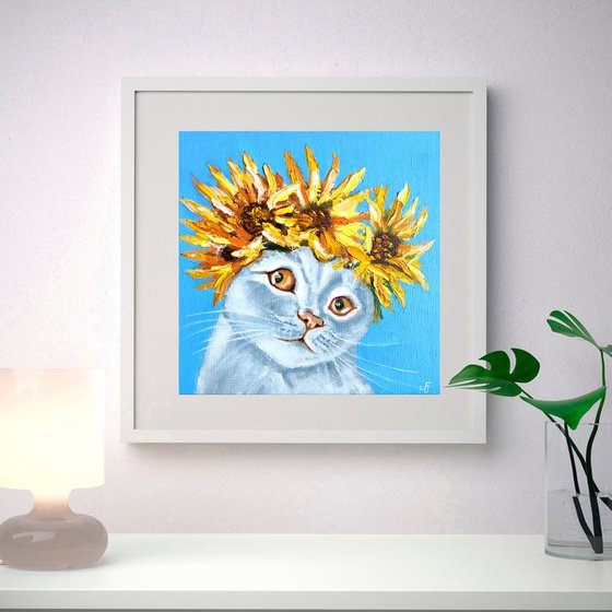 Cat and a wreath of sunflowers