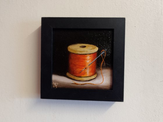 Little Orange  cotton reel  still life