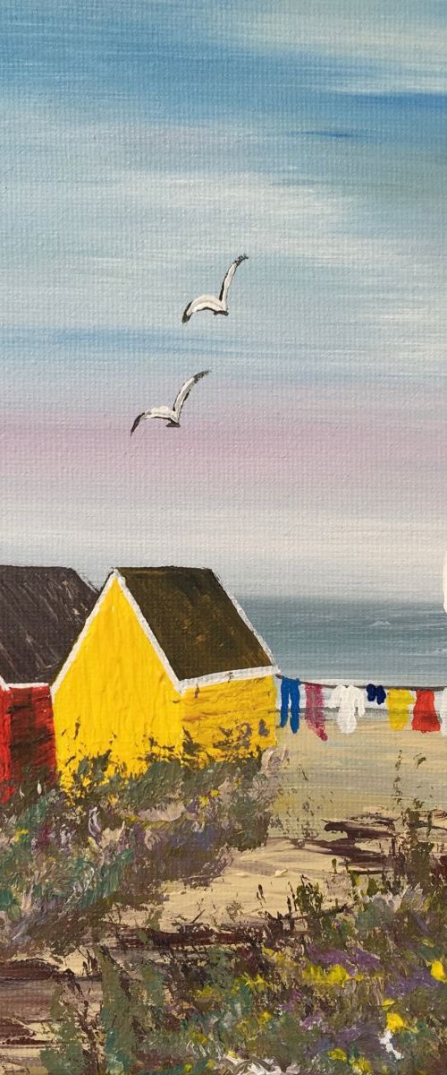 Three beach huts on the beach on a square canvas by Marja Brown