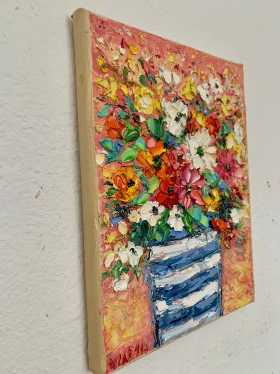 Flowers bouquet in striped vase