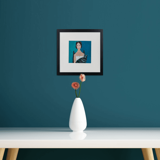 Woman in bodice, Tabby Cat framed