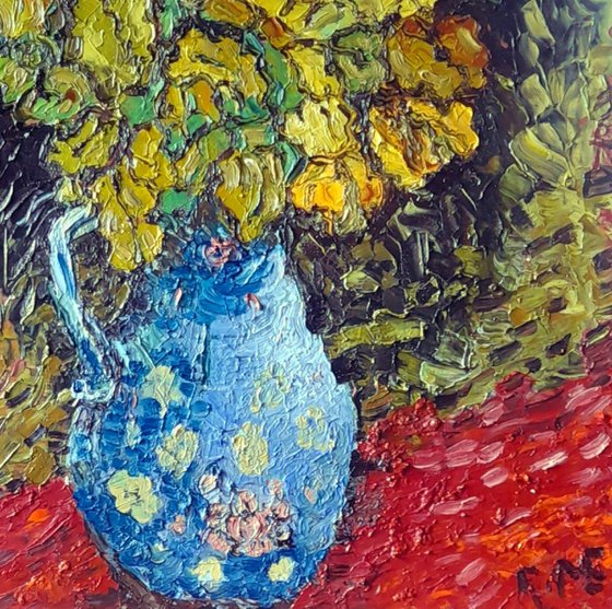 Autumn oak leaves in a blue vase