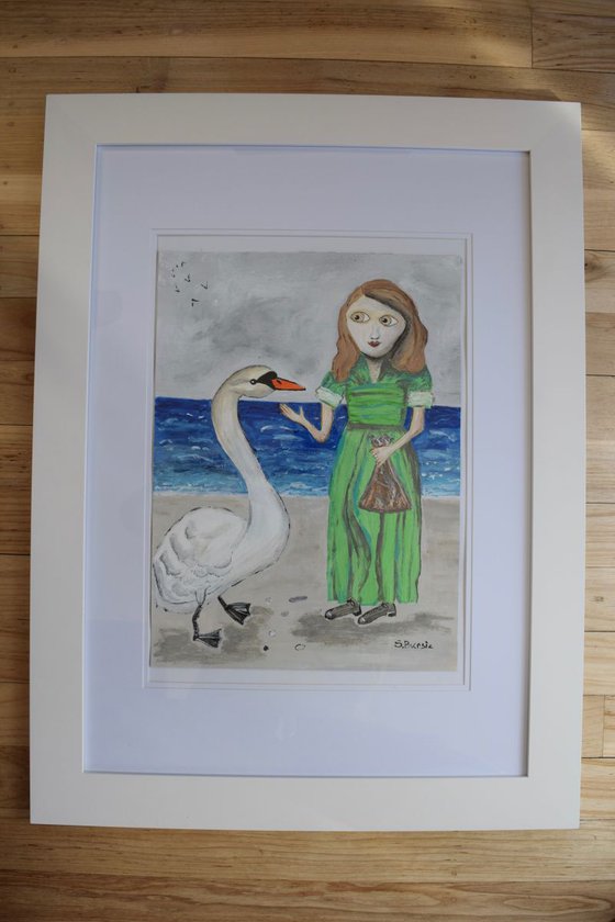 Young lady at beach with white swan