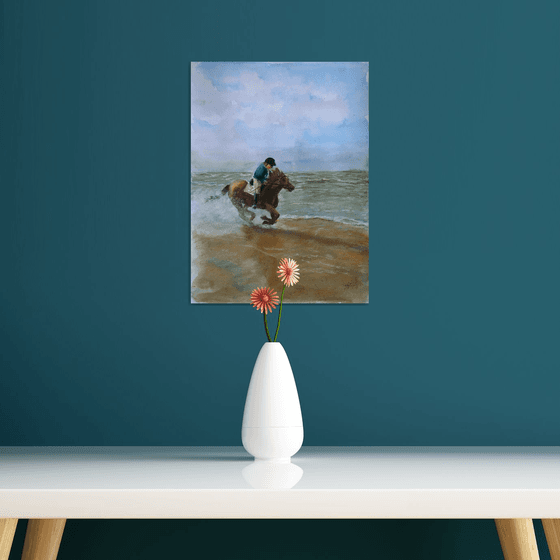 Horse riding along beach