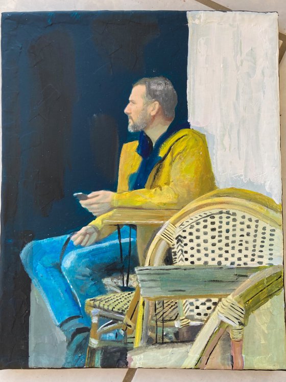Man Sitting At Cafe