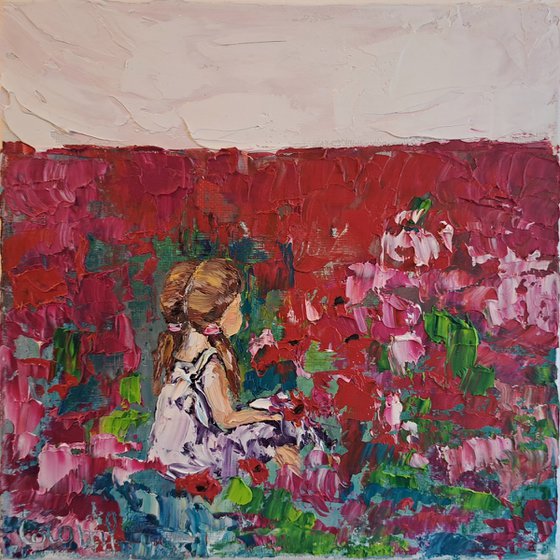 Girl in a  pink flower meadow